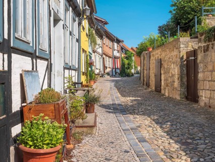 Narrow alley with half-timbered houses and cobblestones on Burgberg in the historic old town,