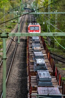 Railway line for freight traffic, freight train loaded with steel slabs, Bottrop, North