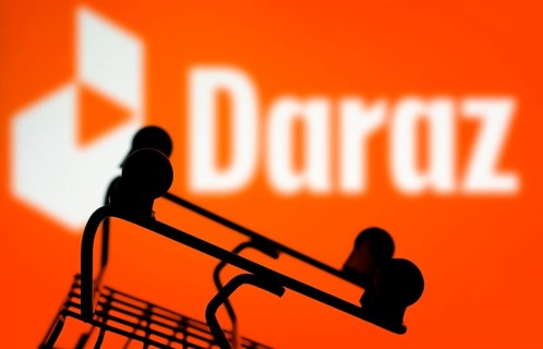 A silhouette of a shopping cart is in front of Daraz.