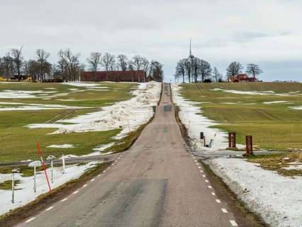 Winter, soon spring. Snowmelt. country road in landscape with melting snow in Ystad municipality,