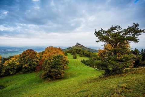 Castle and autumnal forest, Hohenzollern Castle, Hechingen, Swabian Jura, Baden-Württemberg,