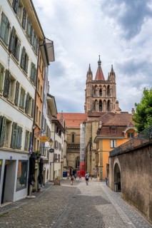 Alley in the Cité and tower of Notre Dame de Lausanne Cathedral, historic old town, Lausanne, Vaud,