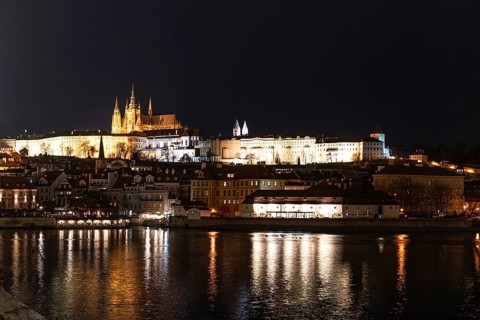Captivating night view of Prague Castle glowing under lights, with historic architecture