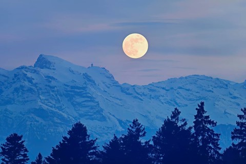 Full moon over snow-covered Titlis, Freiamt, Horben, Lindenberg, Aargau Canton, Switzerland