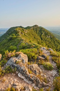 View onto the mountain range of Mount "La Talaia del Montmell" at evening, Catalonia, Spain