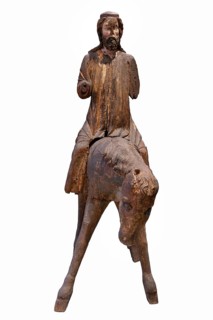 Palm tree donkey, wooden figure from around 1350, on a white background, Diocesan Museum,