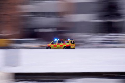 Ambulance on a road, winter, Germany
