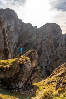 A young man enjoying at the top of the mountain of Aiako Harria or Peñas de Aya in the town of