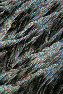 A vibrant image showcasing vivid Vitamin C crystals under microscopic view, highlighting intricate