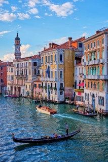 VENICE, ITALY, JUNE 27, 2018: Grand Canal with boats and gondolas on sunset, Venice, Italy