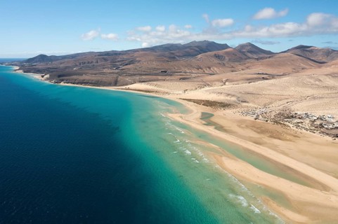 A breath-taking aerial view of Sotavento Beach in Fuerteventura, highlighting the turquoise waters