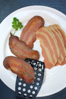 Artificial bacon as imitation meat, imitation bacon on plate, meat substitute