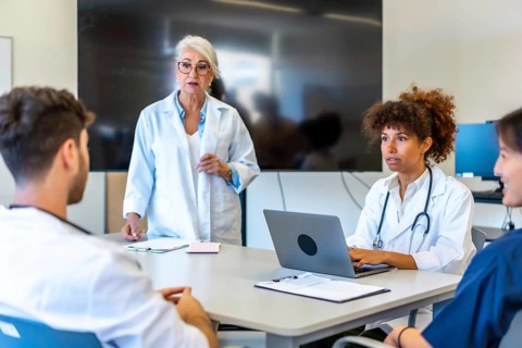 Doctors and medical professionals collaborating, sharing expertise, and analyzing patient