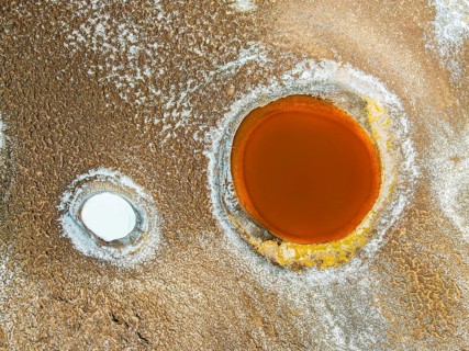 Top view, the Salar de Antofalla in Catamarca, Argentina, showcases vibrant salt pools surrounded