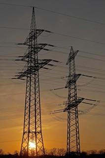 Sunset behind high-voltage pylons, Häcklingen, Lüneburg, Lower Saxony, Germany