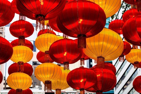 A stunning array of red and yellow lanterns brightly illuminated, celebrating Chinese New Year in