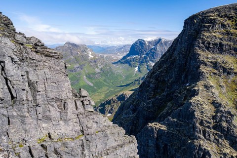 View between rocks at the summit of Innerdalstårnet on Innerdalen high valley, Trollheimen Mountain