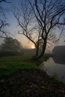 Morning sun on a foggy morning at Gut Othenstorf, Othenstorf near Rehna, Mecklenburg-Vorpommern,