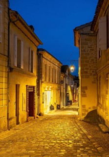 Narrow street in Saint-Emilion by night, France