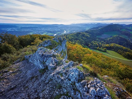 View from the Gisliflue of an autumnal forest with the Jura foothills behind, Talheim, Canton,