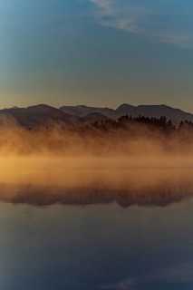 Autumnal morning atmosphere at Schmutter Weiher with fog near Lechbruck, Halblech and Roßhaupten in