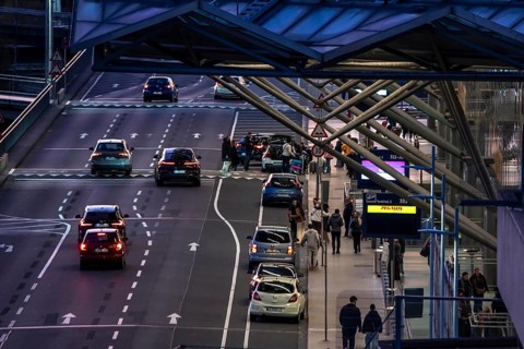 Right of way on the departure level of Cologne-Bonn Airport, skyline of Cologne city center,