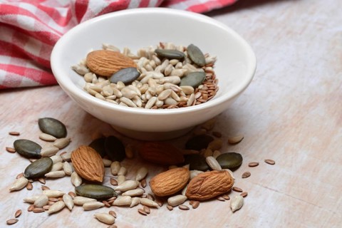 Kernels in shell, kernel mix of almond seeds, sunflower seeds, linseeds and pumpkin seeds