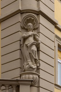 Figure of a saint on a corner house, Kitzingen, Lower Franconia, Bavaria, Germany