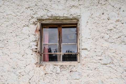 View of the window of a hut on the Glatsch Alm, Dolomites, Puez-Geisler nature park Park, Odle