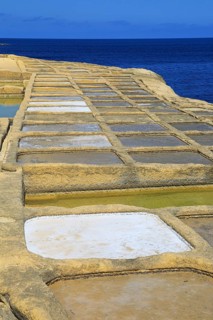 Historic ancient salt pans on coast near Marsalforn, island of Gozo, Malta