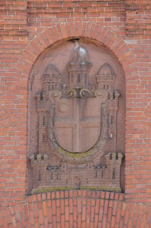 Red city coat of arms with stone, old slaughterhouse, brick building, monochrome, Bruchsal,
