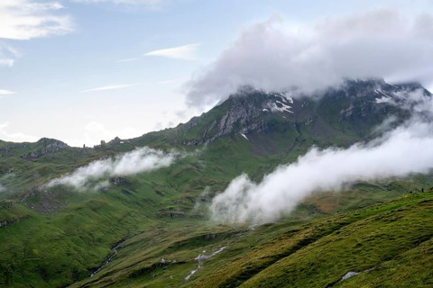 Clouds move around mountain peaks, Grindelwald First, Bernese Alps, Bernese Oberland, Switzerland