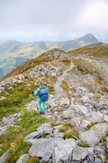 Hiker on hiking trail, Carnic Main Ridge, Carnic High Trail, Carnic Alps, Carinthia, Austria