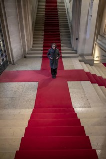 Woman Standing on Red Carpet on Staircase in Switzerland