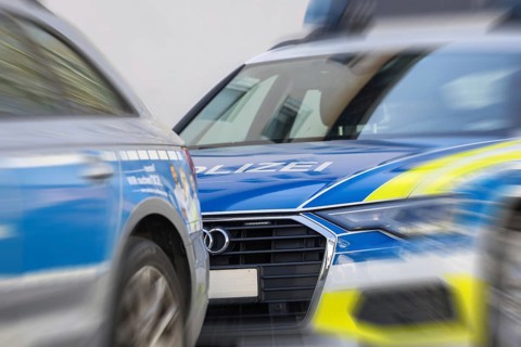 Symbolic image of police operation: close-up of police emergency vehicles