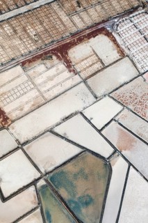 Stunning aerial shot capturing the earthy and vibrant textures of the salt pans at Los Salares de
