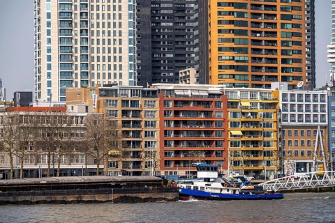Shipping traffic on the Nieuwe Maas, city center skyline, cargo ships, Rotterdam, Netherlands