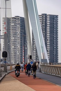 The Erasmus bridge over the Nieuwe Maas in Rotterdam, pedestrians, two-wheelers, cars, tram