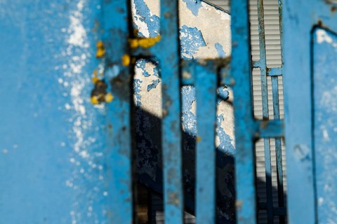 Blue railing, old building