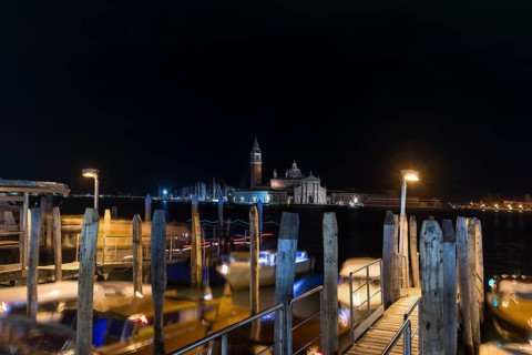 San Marco night-time boat dock, in the back the island of Saint Giorgio Maggiore, Venice, Veneto,