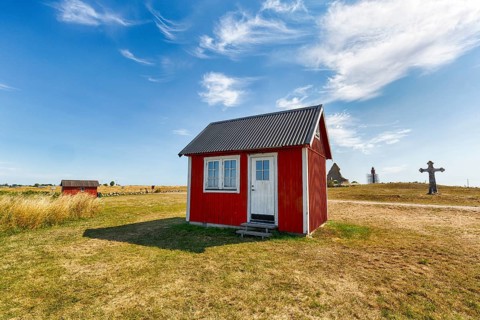 Typical little red house, classic Scandinavian summer house or fishing hut, historic town of