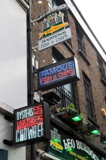 Food signs outside fish and chips restaurant, Dublin city centre, Ireland, Republic of Ireland
