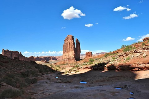 Noticeable massive rock formation in a wide desert landscape, Arches National Park, Utah, USA