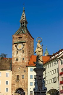 Medieval gate tower, town gate Schmalzturm or beautiful tower, fountain figure of the Virgin Mary,