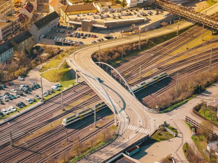 The urban bridge structure with vehicles over a railway rail network, Mühlacker, Enzkreis, Germany