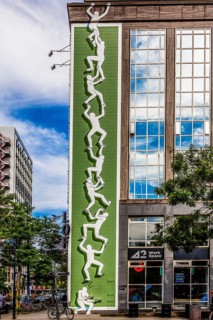 Artwork from the Rotterdam Make It Happen street art campaign in the city center, invites