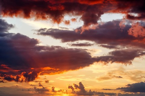 Dramatic cloud sky at sunset, intense colors, sunset, irregular cloud formation, filling format,