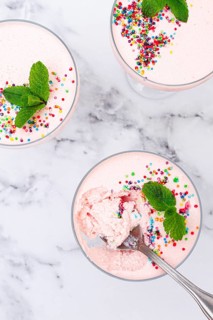 Fruit mousse, made from jelly and cottage cheese, in glasses, decorated with sprinkles and mint,