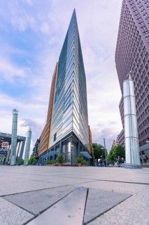A striking high-rise building with a glass façade that rises towards the sky, Berlin, Germany