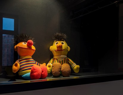 Sesame Street, Ernie and Bert rag dolls behind glass in the Museum of Communication, Berlin,